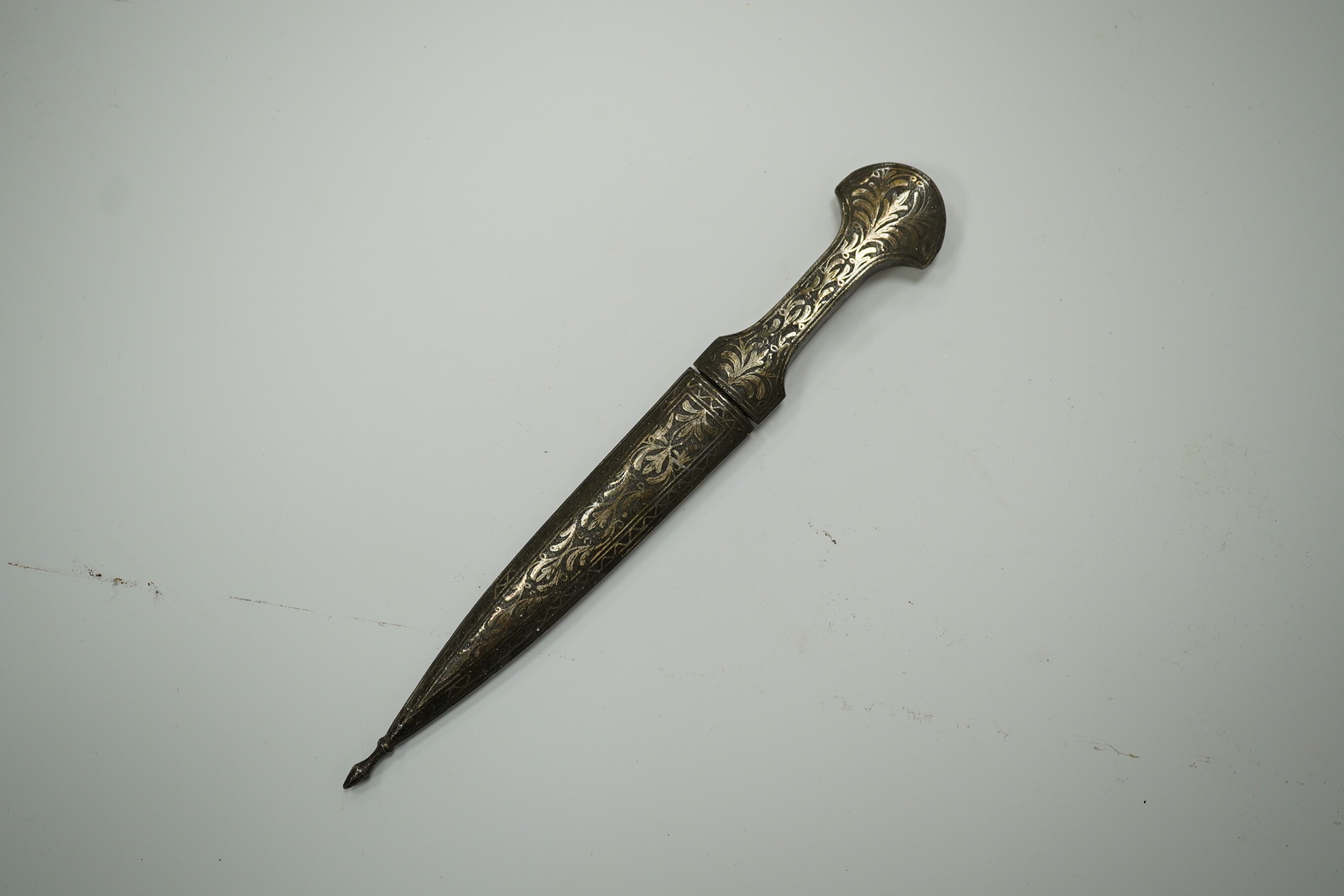 An Ottoman silver damascened dagger c.1900 in matching sheath, blade 9.7cm. Condition - fair